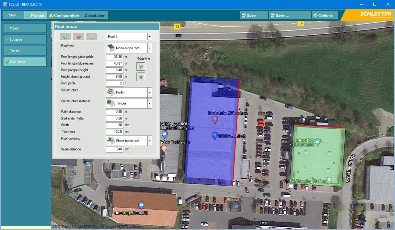 A screenshot of a mapping software interface showing roof area calculations for two highlighted buildings in blue and green. Various measurement parameters are displayed in a side panel.