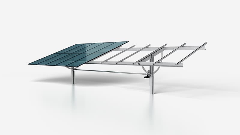 A ground-mounted solar panel system with a partially assembled frame on a plain white background.