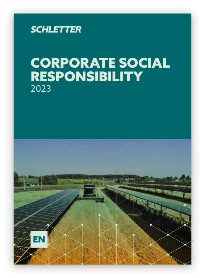Cover of "Corporate Social Responsibility 2023" by Schletter, featuring an image of solar panels installed in a field under a clear sky.