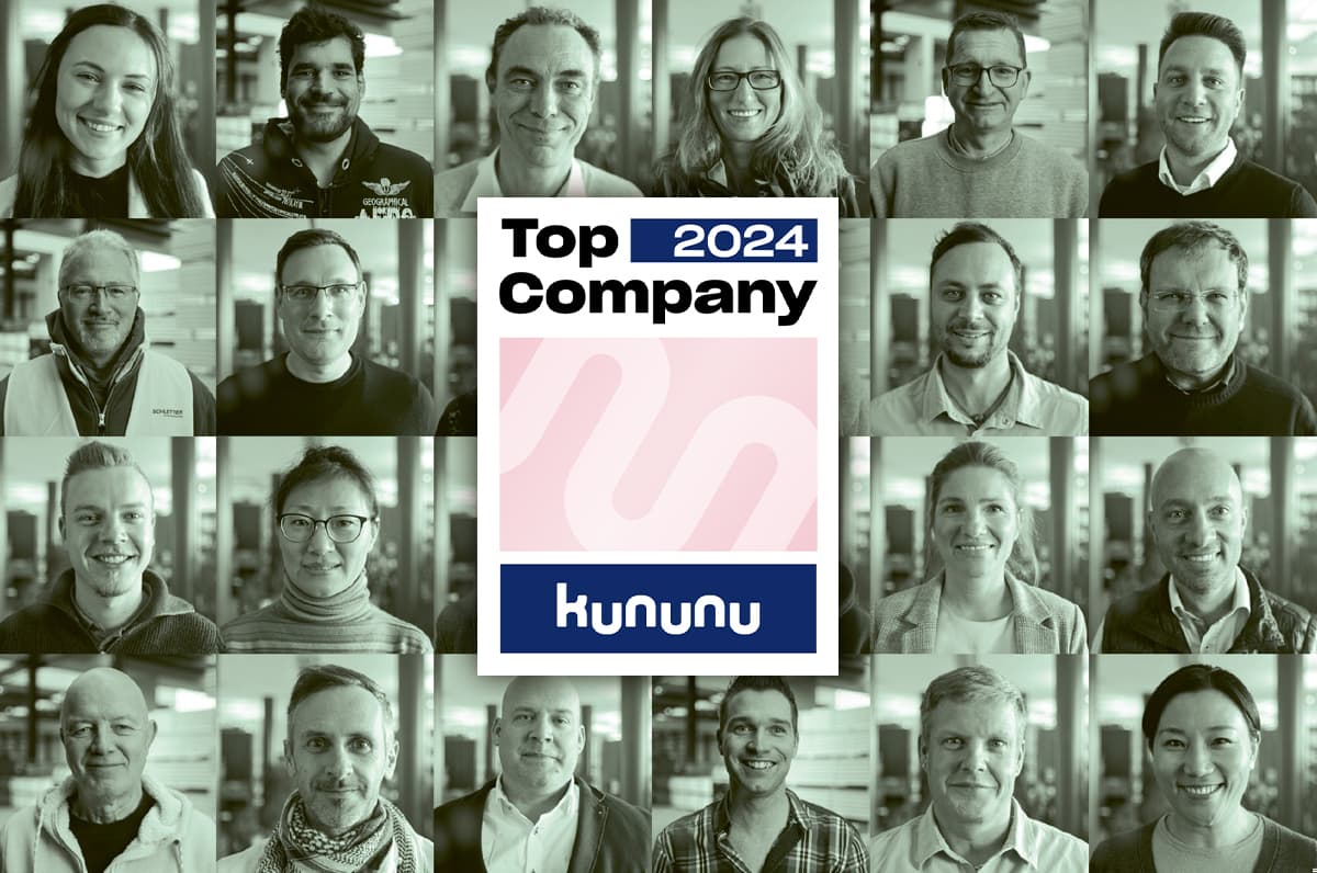A group of diverse individuals posing around a central badge that reads "Top Company 2024, kununu.
