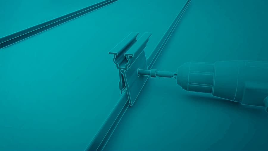 A power drill is being used to screw a metal bracket into a flat surface. The image has a teal filter, giving it a uniform color tone.
