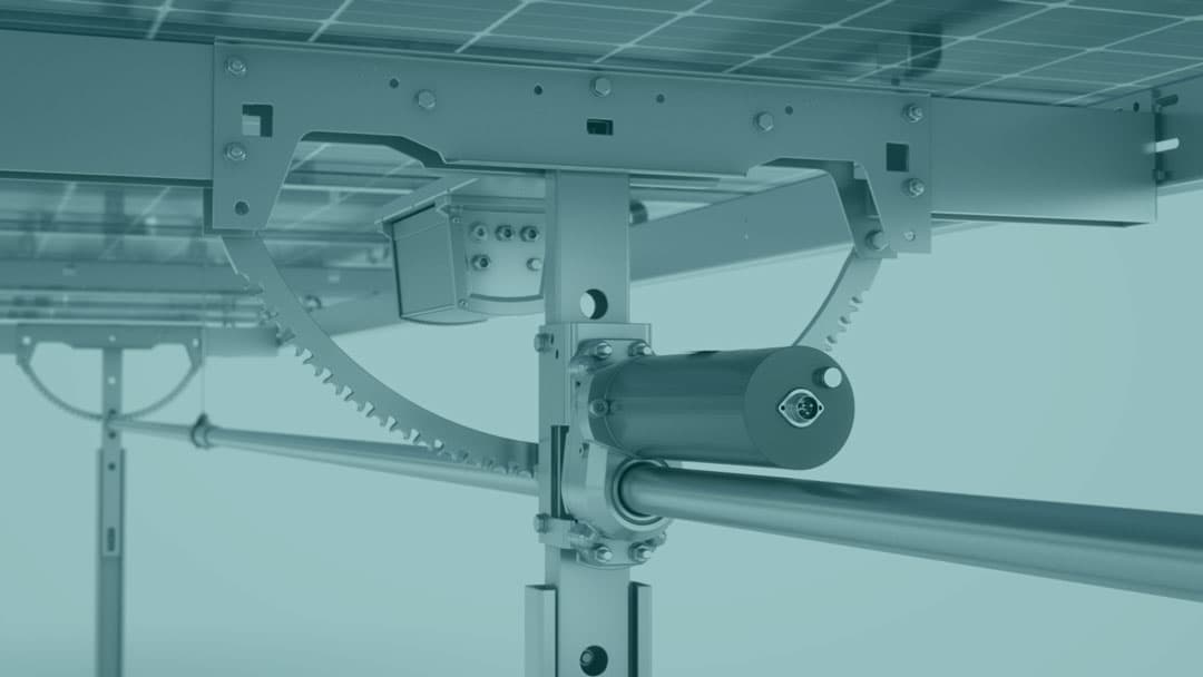 Close-up of a mechanical structure with metal gears and rods, likely part of a solar panel system.
